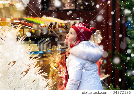 Child at Christmas fair. Xmas market. Child at Christmas fair. Xmas market. 34272186