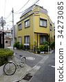 Yellow house and bicycle in Tokyo, japan 34273085