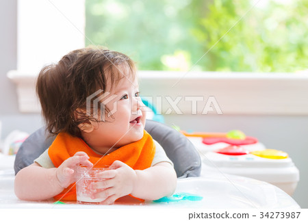 Happy little baby boy eating food Happy little baby boy eating food 34273987