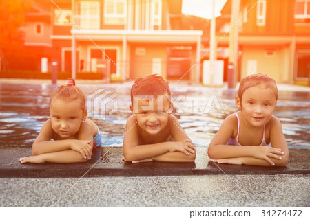 A happy three children relaxing. Toned 34274472