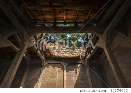 Damaged roof of an abandoned building 34274622