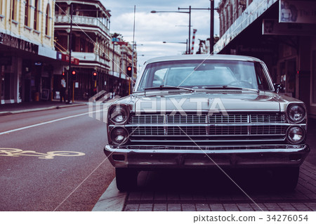 Retro car and cityscape 34276054