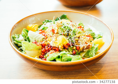 Grilled chicken with vegetable and pomegranate , fruits salad in plate - Color Filter Processing 34277138