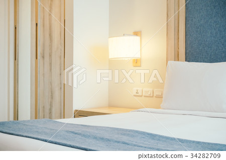 White pillow on bed White pillow on bed 34282709