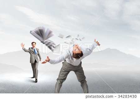 Two business people fighting with each other 34283430