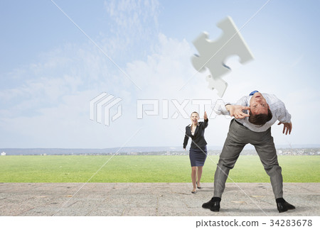 Man evading flying puzzle Man evading flying puzzle 34283678