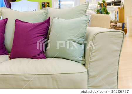 Beautiful modern living room with green pillows Beautiful modern living room with green pillows 34286727