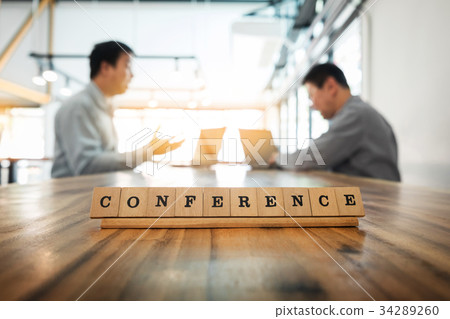 Conference word on wood table with Business team work discussion Conference word on wood table with Business team work discussion 34289260