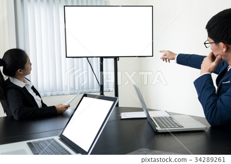 young Businessman working a video conference using a desktop com young Businessman working a video conference using a desktop com 34289261