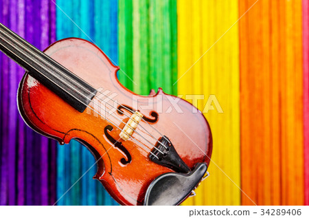 Violin on colorful wooden. 34289406