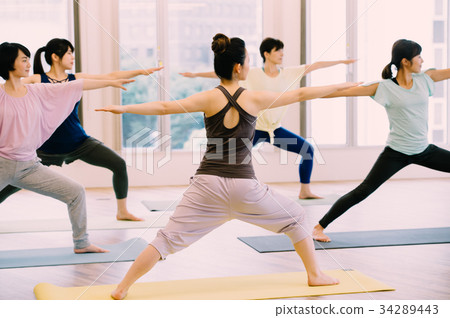 Young woman doing yoga in yoga studio 34289443