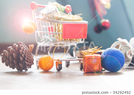 Close up of shopping cart with gift boxes 34292492