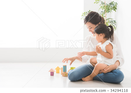 Parents and children playing indoors Parents and children playing indoors 34294118