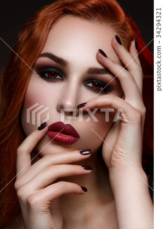 Beautiful vampire young woman Beautiful vampire young woman 34294321