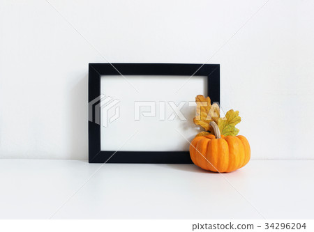 Black blank wooden frame mockup with an orange Black blank wooden frame mockup with an orange 34296204