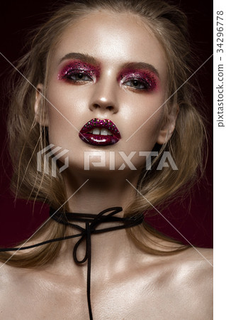 Beautiful girl with creative bright makeup with 34296778