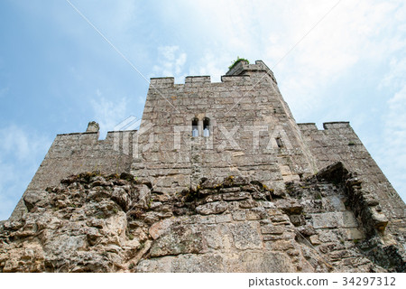 Stone wall left like rubble in an old castle outside England Stone wall left like rubble in an old castle outside England 34297312