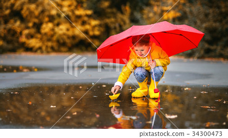 happy child girl in puddle happy child girl in puddle 34300473