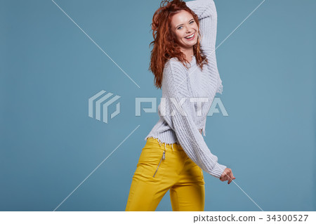 young redhead woman in autumn color isolated on fall background young redhead woman in autumn color isolated on fall background 34300527