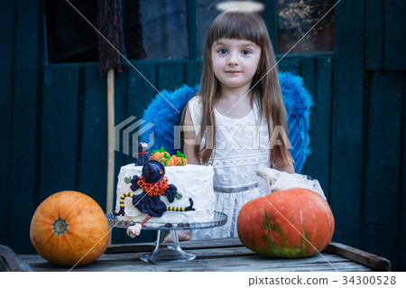 The girl near the celebratory cake The girl near the celebratory cake 34300528