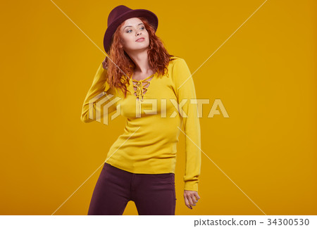 young redhead woman in autumn color isolated on fall background young redhead woman in autumn color isolated on fall background 34300530