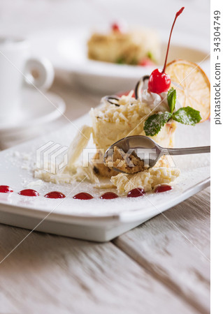 Tasting of creamy orange dessert 34304749