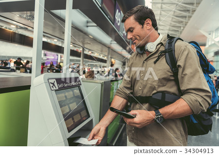 Positive man is using modern device Positive man is using modern device 34304913