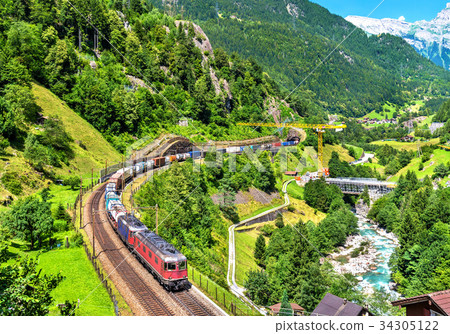 Freight train climbs up the Gotthard railway - 34305122