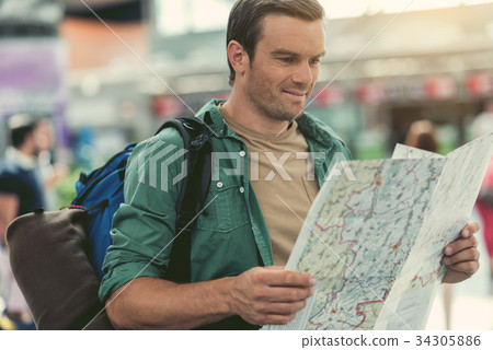 Positive guy is considering place for summer trip Positive guy is considering place for summer trip 34305886
