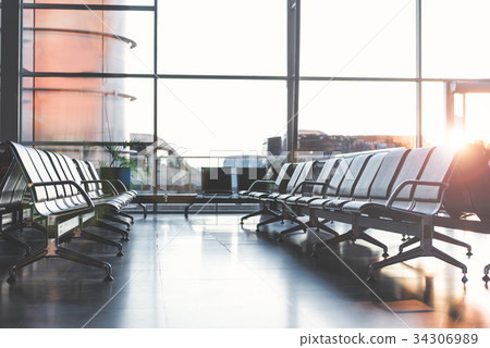 Wide airdrome hall with comfortable chairs Wide airdrome hall with comfortable chairs 34306989