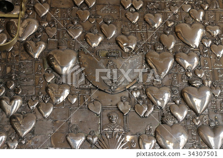 Metal hearts in the church Ostra Brama. Vilnius. Metal hearts in the church Ostra Brama. Vilnius. 34307501