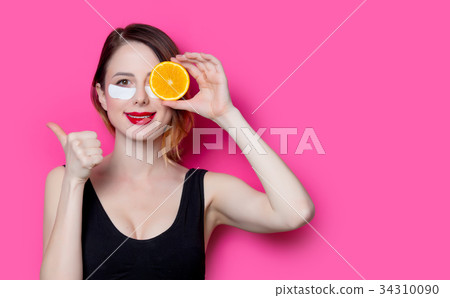 Woman using eye patch for her eyes 34310090