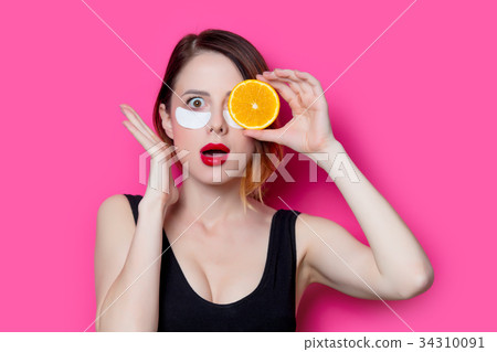 Woman using eye patch for her eyes 34310091