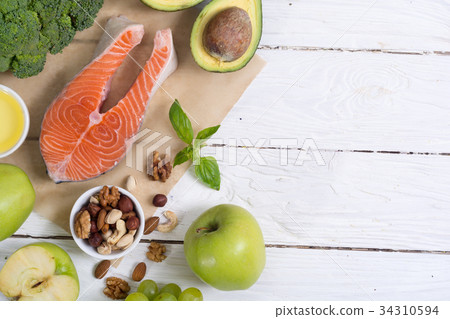 Healthy food vegetables , nuts and salmon 34310594