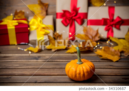 leaves and pumpkin with Halloween gift box leaves and pumpkin with Halloween gift box 34310687