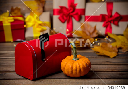 leaves and pumpkin with Halloween gift 34310689