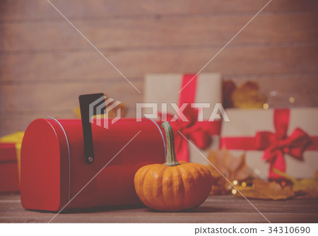 leaves and pumpkin with Halloween gift box leaves and pumpkin with Halloween gift box 34310690