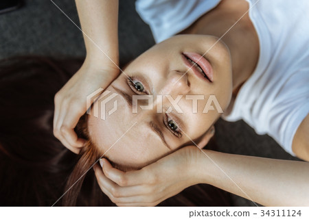 Unhappy gloomy woman looking at you Unhappy gloomy woman looking at you 34311124