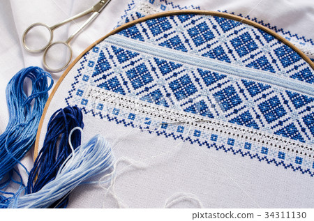 Design of ethnic pattern. Cross stitch. Design of ethnic pattern. Cross stitch. 34311130