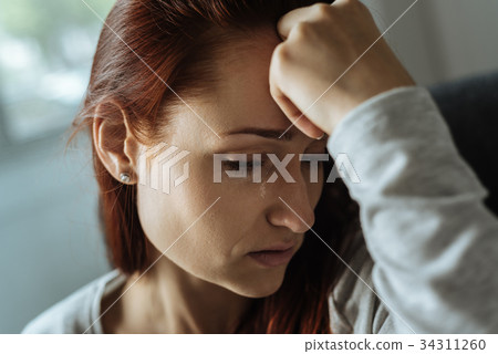 Depressed unhappy woman expressing her grief 34311260