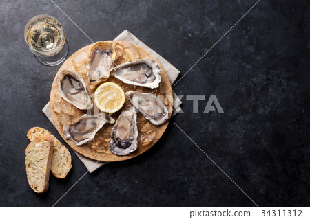Oysters and wine 34311312