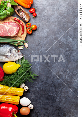 Vegetables, fish, meat and ingredients cooking 34311477