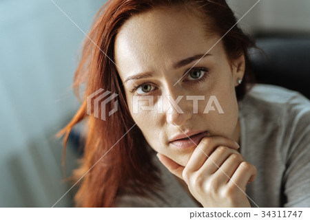 Portrait of a beautiful thoughtful woman 34311747