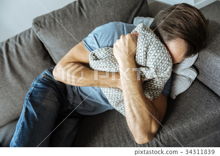 Depressed sad man being in griefb Depressed sad man being in griefb 34311839