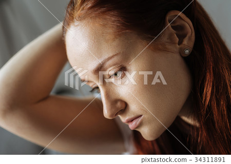 Portrait of a beautiful sad woman Portrait of a beautiful sad woman 34311891
