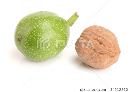 fresh walnuts in peel isolated on white background fresh walnuts in peel isolated on white background 34312810