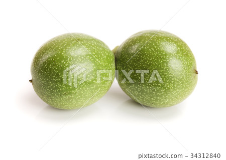fresh walnuts in peel isolated on white background fresh walnuts in peel isolated on white background 34312840