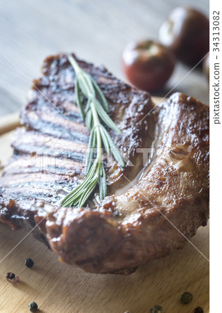 Grilled lamb ribs on the wooden board 34313082
