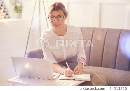 Intelligent attractive businesswoman looking at Intelligent attractive businesswoman looking at 34313230