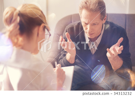 Depressed cheerless man complaining about his 34313232